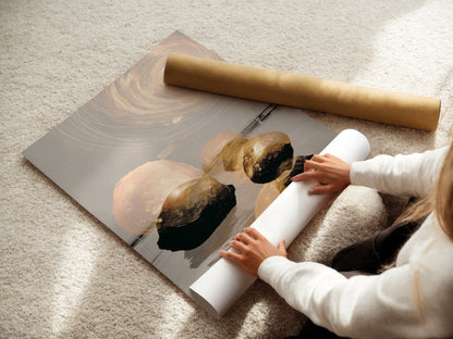A woman is carefully rolling a fine art poster paper print. This demonstrates the care and quality of our printing process. The Abstract Zen artwork is ready to be framed and displayed. Perfect for adding a touch of modern minimalist style to your space. Shop now.
