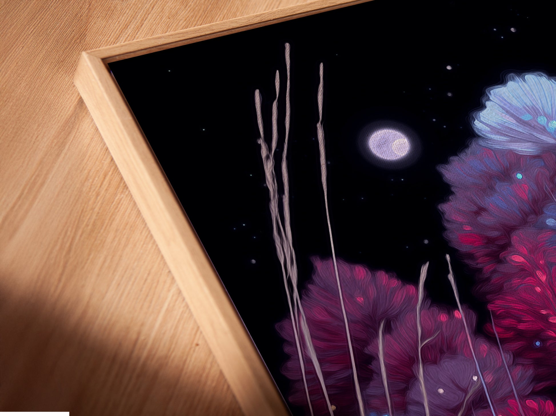 A close-up angled view shows the canvas print in a floating frame. The indigo and violet tones of the flower field artwork are vibrant. This modern piece is perfect for adding a touch of elegance. Homeowners and renters love this piece.