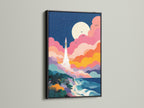 A striking black frame surrounds this canvas art. The artwork depicts a rocket taking off near the ocean. The black frame adds drama and sophistication to the piece. Choose a black frame to make your art pop.