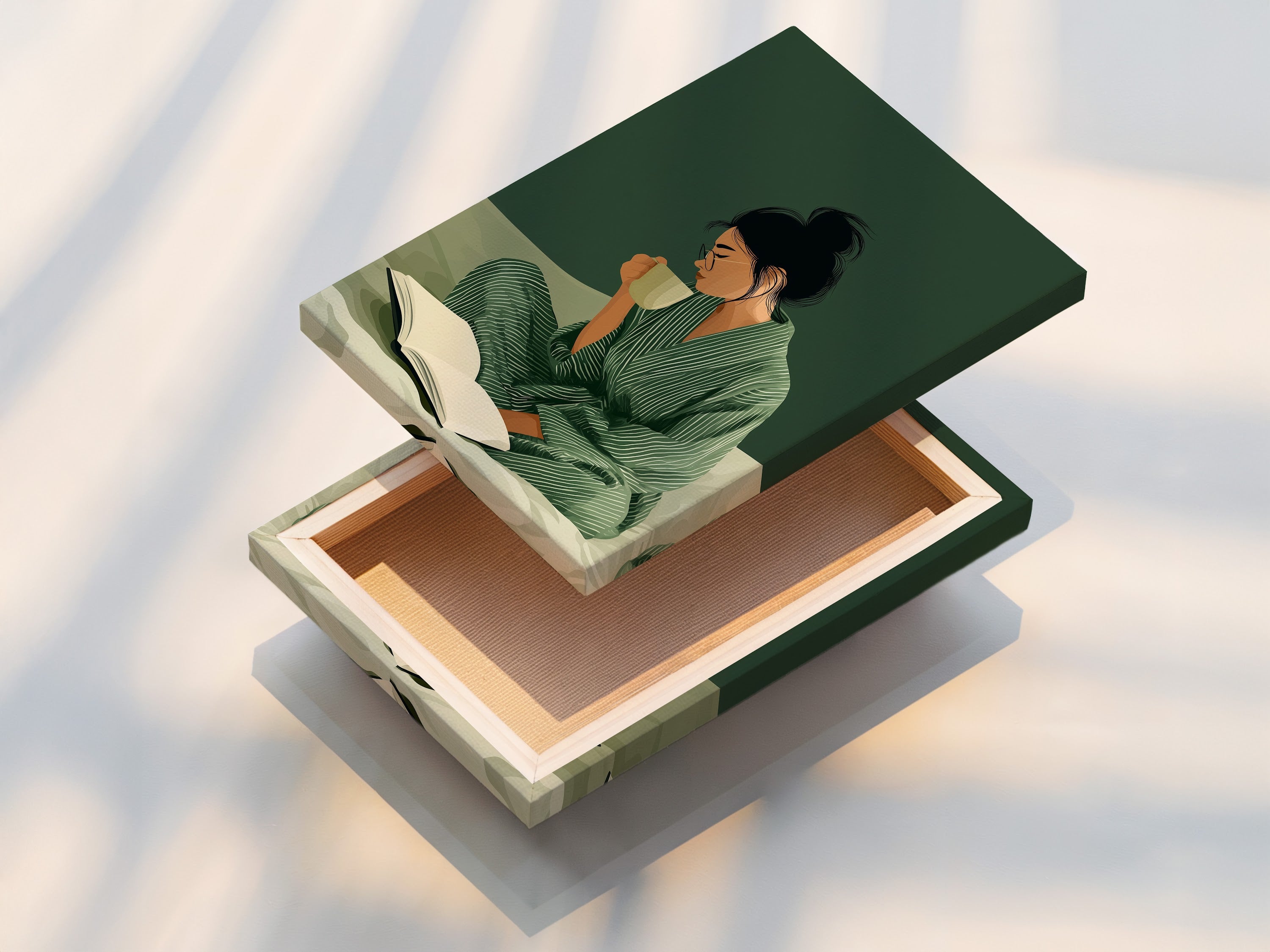 A stretched canvas print of a woman reading. Featuring sage green and beige tones. This contemporary wall decor is ready to hang. A perfect piece for creating a serene atmosphere.