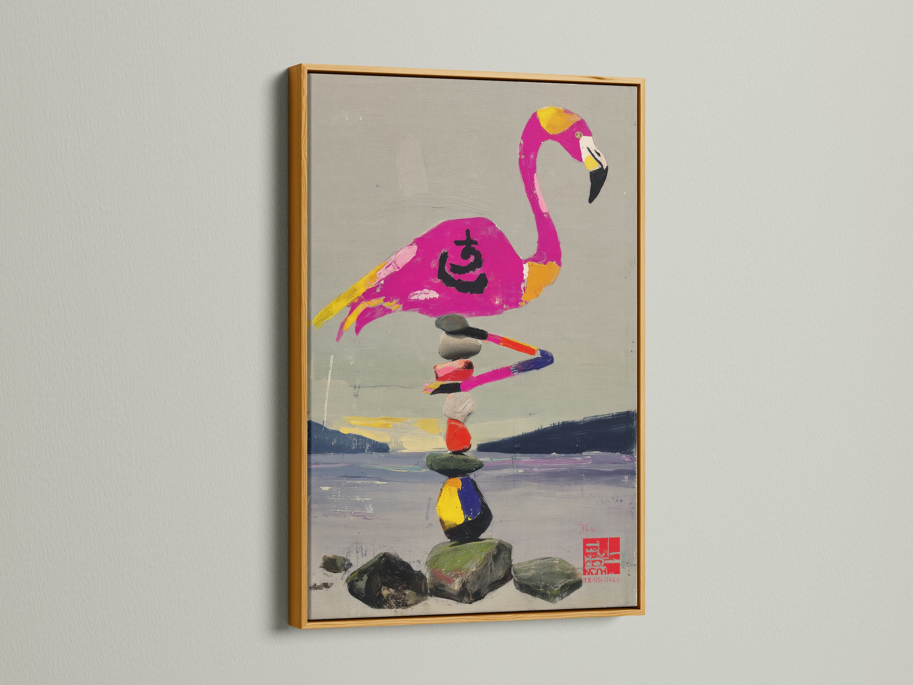 A gold frame enhances this flamingo and zen stone stack artwork. The art piece features a colorful bird balancing stones. The gold frame adds a touch of elegance. It makes it a perfect addition to a spa or sunroom. 