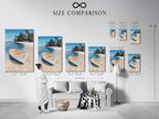 Size comparison chart displayed in an interior setting. Showcasing various sizes of our tropical beach artwork. This coastal wall art features a white boat. Find the perfect fit for your space. Explore our seascape paintings and beachy home decor options.
