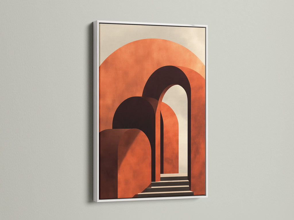 Artwork displayed in a crisp white frame on a bright white wall. The art features terracotta arches. A white frame offers a clean and modern aesthetic. It ensures the art remains the focal point of the room.