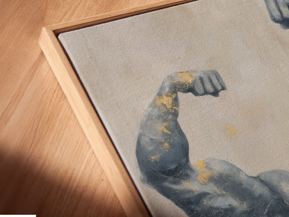 Close-up of a canvas print in a floating frame. The bodybuilder art has gray and gold tones. A modern piece of fitness decor. Ideal for gym wall art or a unique trainer gift. See the fine details.