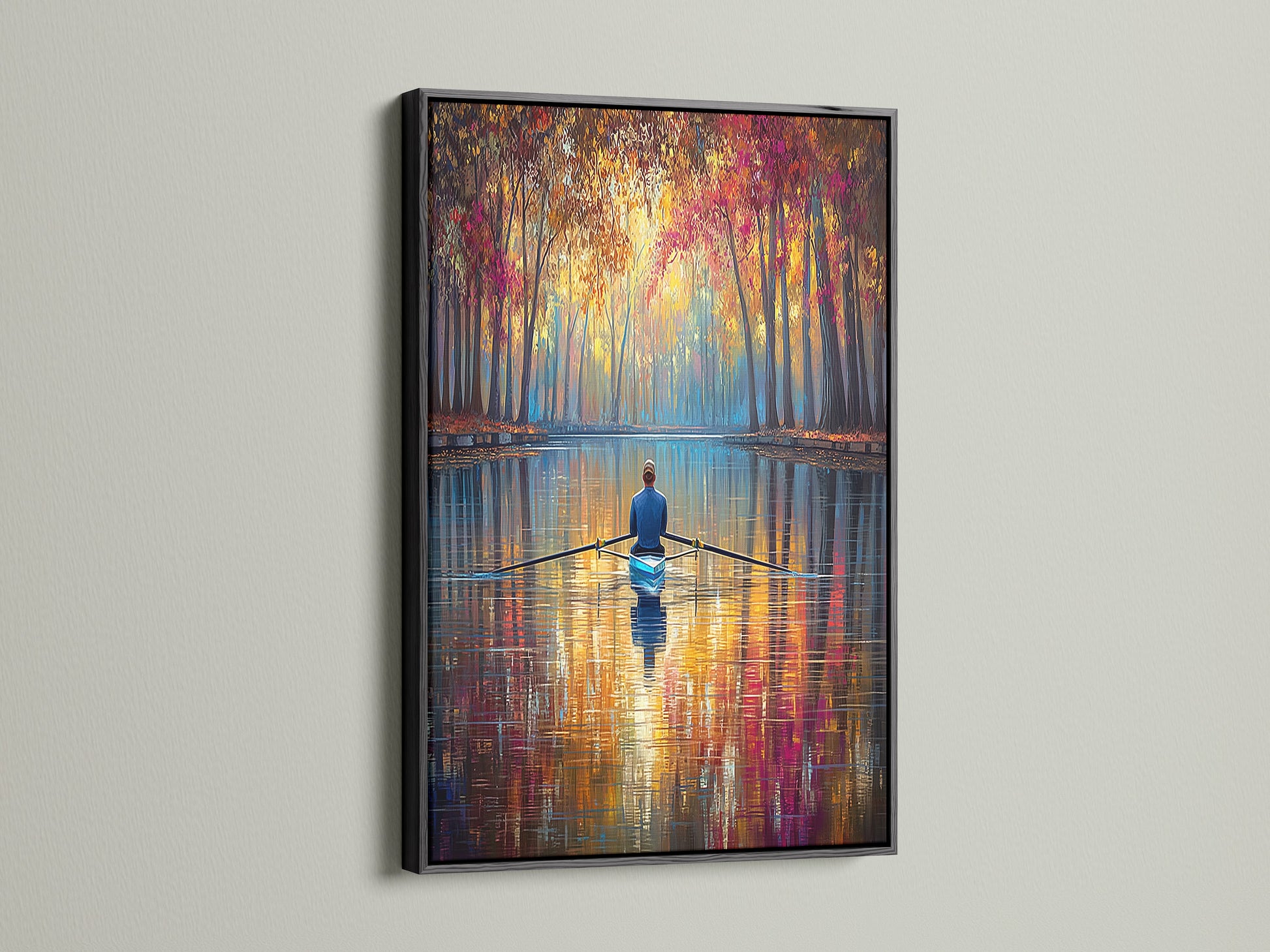 Enhance your home decor with this Rowing Canvas Print in a black frame. The bold black frame accentuates the artwork's vibrant colors. This autumn wall art makes a statement in any space. The tranquil scene brings a sense of calm to your home. A perfect addition for art lovers.