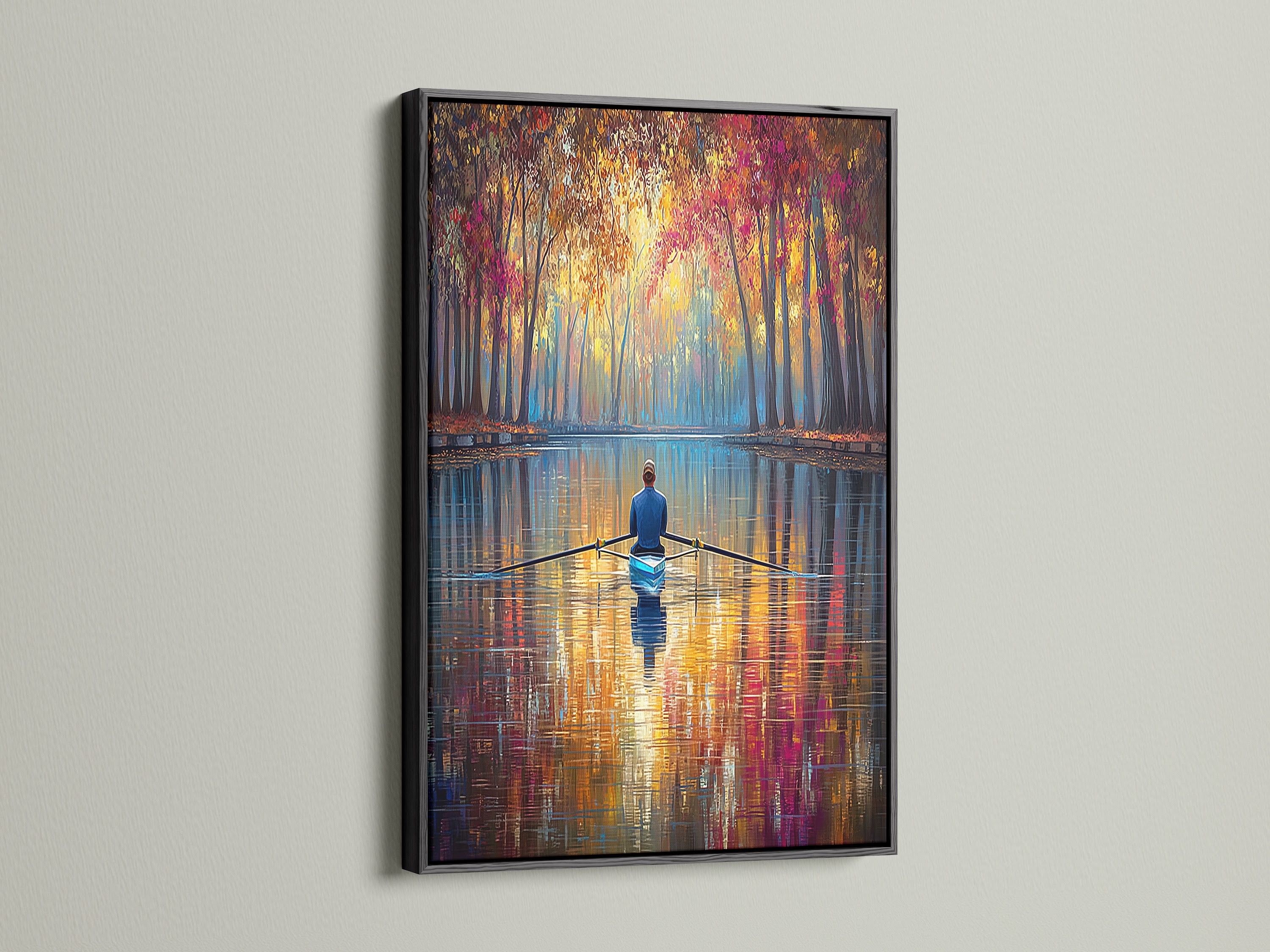 Enhance your home decor with this Rowing Canvas Print in a black frame. The bold black frame accentuates the artwork's vibrant colors. This autumn wall art makes a statement in any space. The tranquil scene brings a sense of calm to your home. A perfect addition for art lovers.