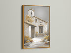 Artwork with a gold frame. The artwork features a quaint building. It looks like a church or villa. The artwork is matted and framed. The gold frame adds a touch of luxury. Brighten up any room with this beautiful gold-framed artwork.