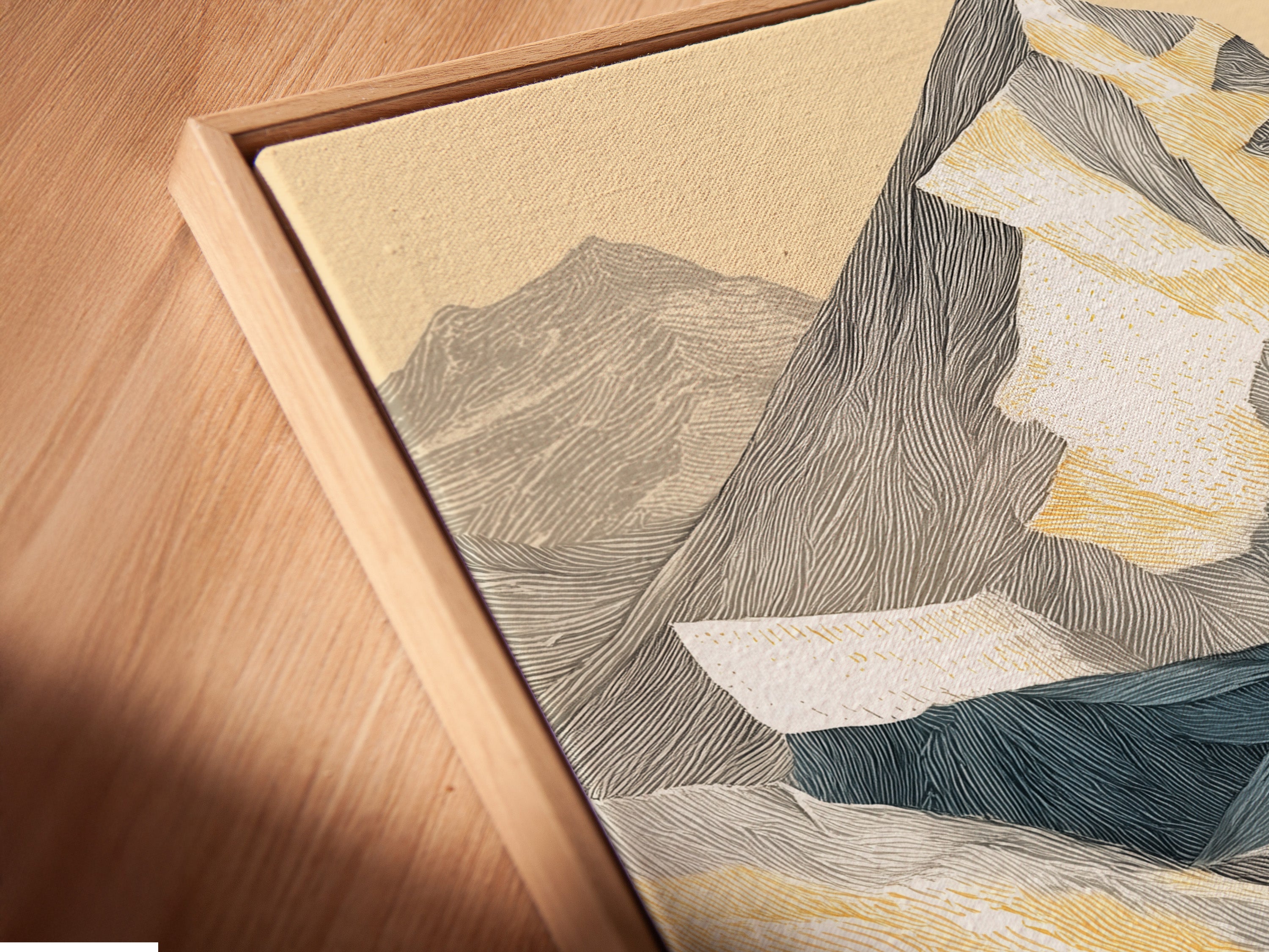 Close up angled view of a canvas print in a floating frame. The artwork shows a mountain landscape. With alpine peaks and golden autumn colors it is a modern nature print. The floating frame adds a contemporary touch.