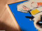 This is a close-up of a canvas print in a floating frame. The chef cat artwork is a funny kitchen print. It is a colorful pop art poster for the dining room. This elevated wall art will fit modern styles.