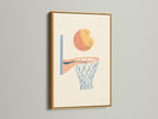 Artwork featuring a basketball above a net is displayed in a gold frame. The metallic gold frame adds a touch of luxury and sophistication. It enhances the artwork with a hint of glamour.