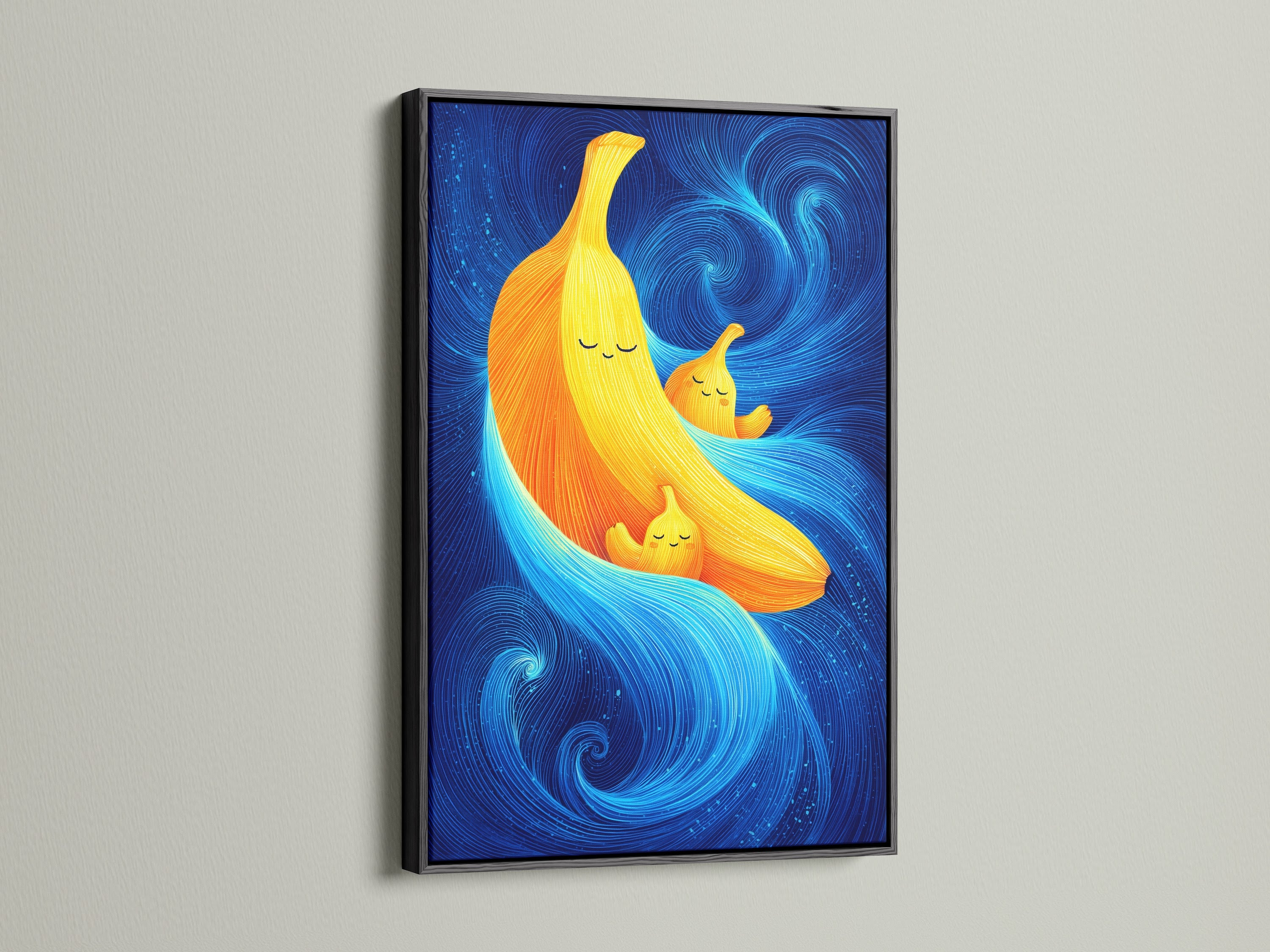A Banana Family Canvas artwork print is presented in a black frame. This abstract print is perfect for nurseries and playrooms. The cute artwork has a food theme. It is a colorful wall art piece.