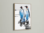 Penguin Family Artwork in an oak frame. The blue and white arctic canvas adds a coastal touch to any room. Ideal wildlife print for nursery wall art or as a gift for animal lovers.
