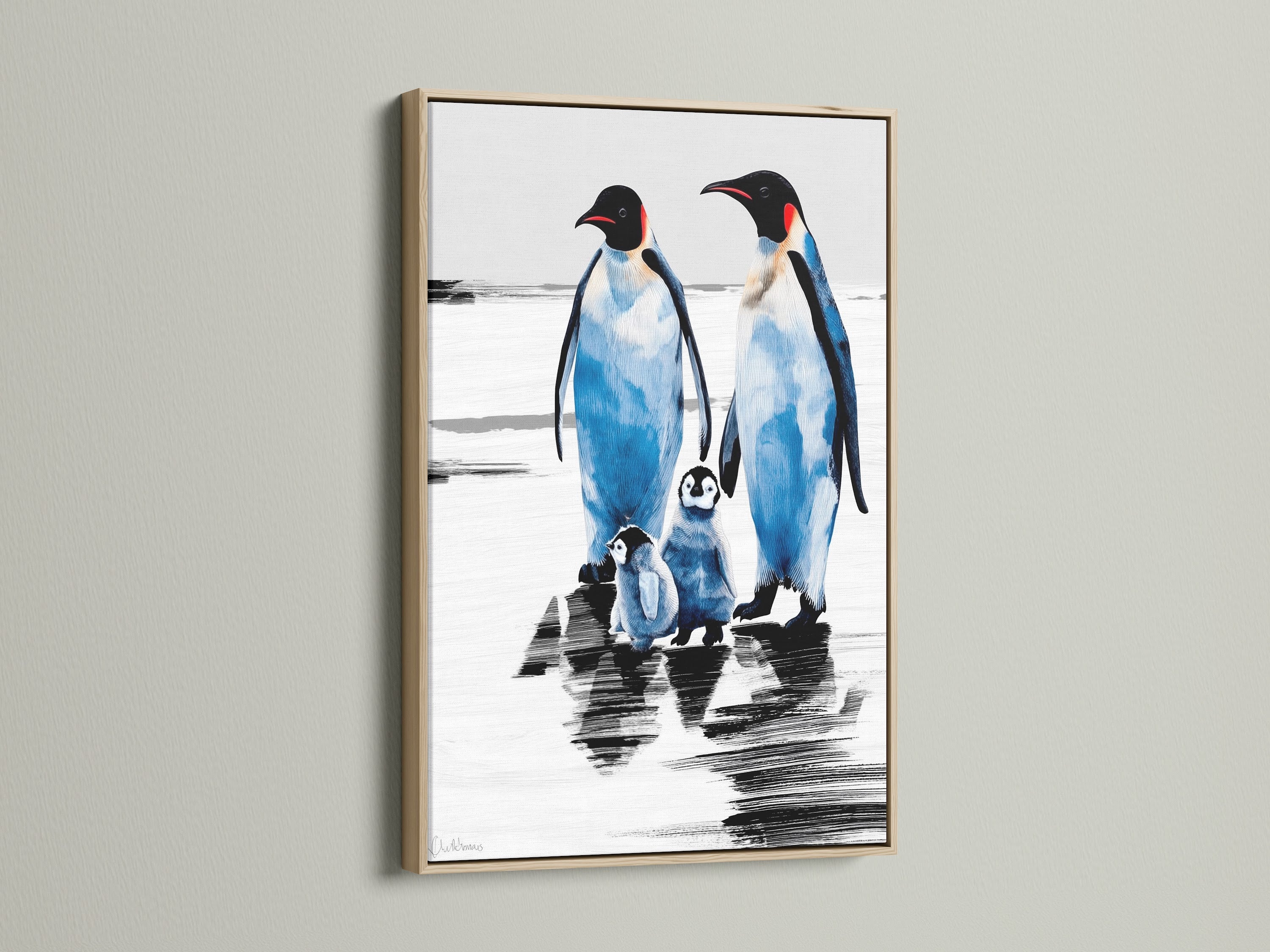 Penguin Family Artwork in an oak frame. The blue and white arctic canvas adds a coastal touch to any room. Ideal wildlife print for nursery wall art or as a gift for animal lovers.