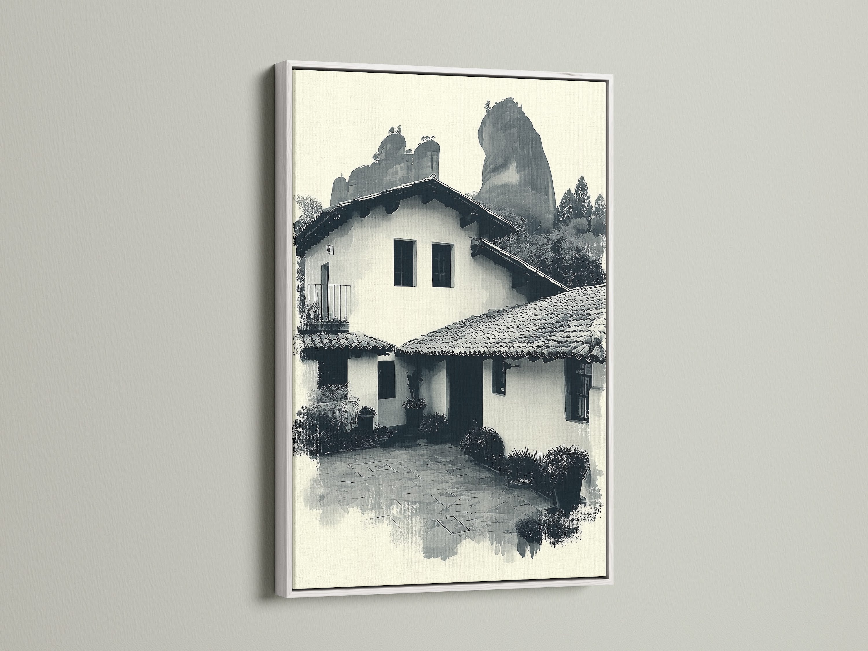 The monochrome Hacienda artwork is presented in a white frame. This southwestern artwork adds elegance to any space. It complements eclectic styles. Consider this casa print for refined home offices and libraries.