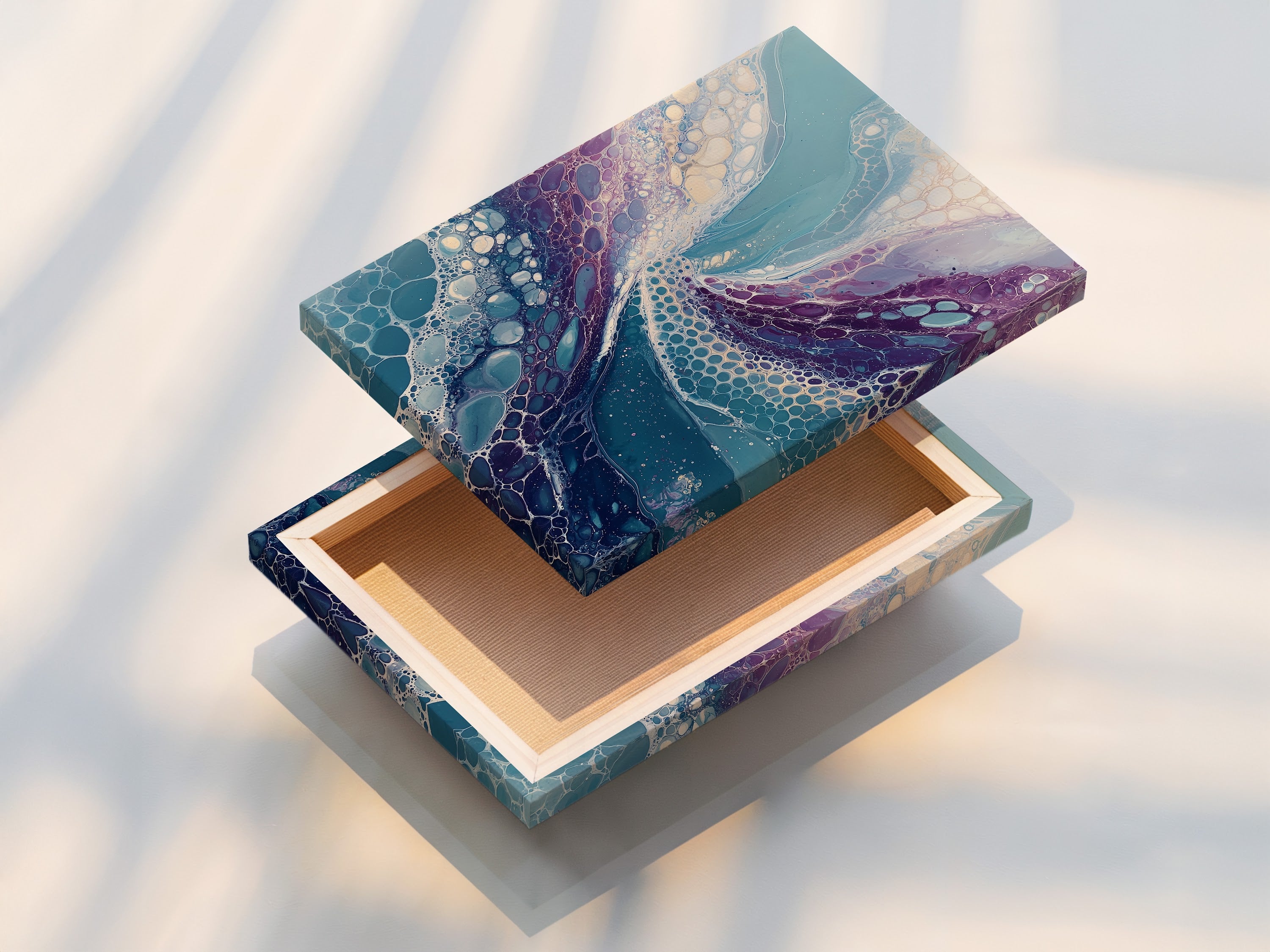 This image showcases a stretched canvas print of abstract fluid art. The teal and purple colors create a stunning visual effect. This modern canvas art is ready to hang. Perfect for bringing contemporary style to any living space. Add an elegant touch with this flowing artwork.