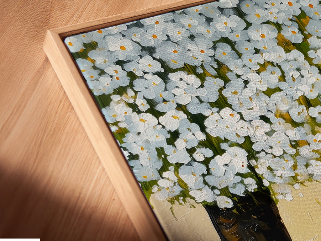 Close-up angled view of a canvas print in a floating frame featuring a cat under a tree. This whimsical animal artwork is perfect for nurseries. The spring blossom art enhances any room with a touch of nature. Ideal for cat lovers seeking contemporary minimalist art.