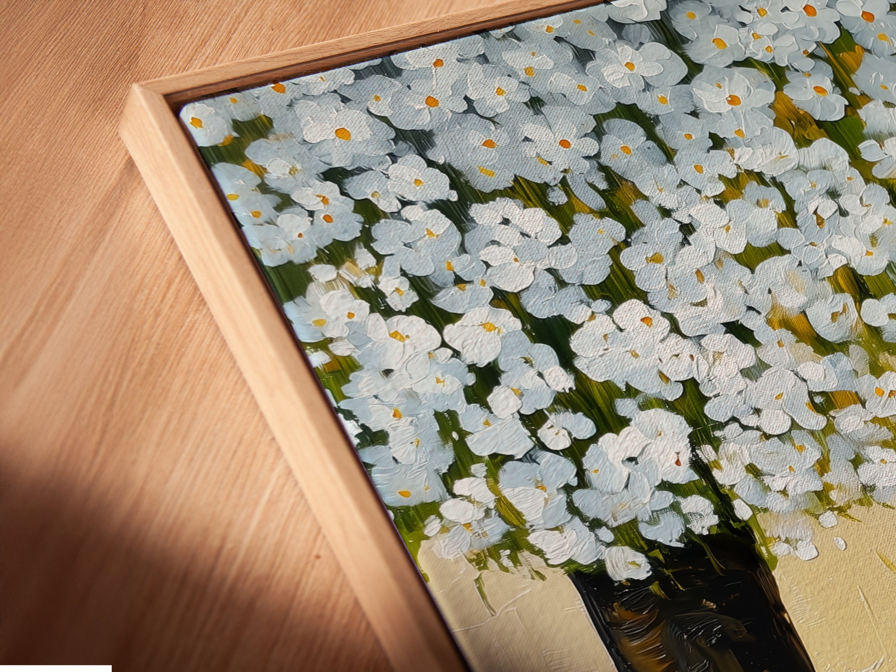 Close-up angled view of a canvas print in a floating frame featuring a cat under a tree. This whimsical animal artwork is perfect for nurseries. The spring blossom art enhances any room with a touch of nature. Ideal for cat lovers seeking contemporary minimalist art.