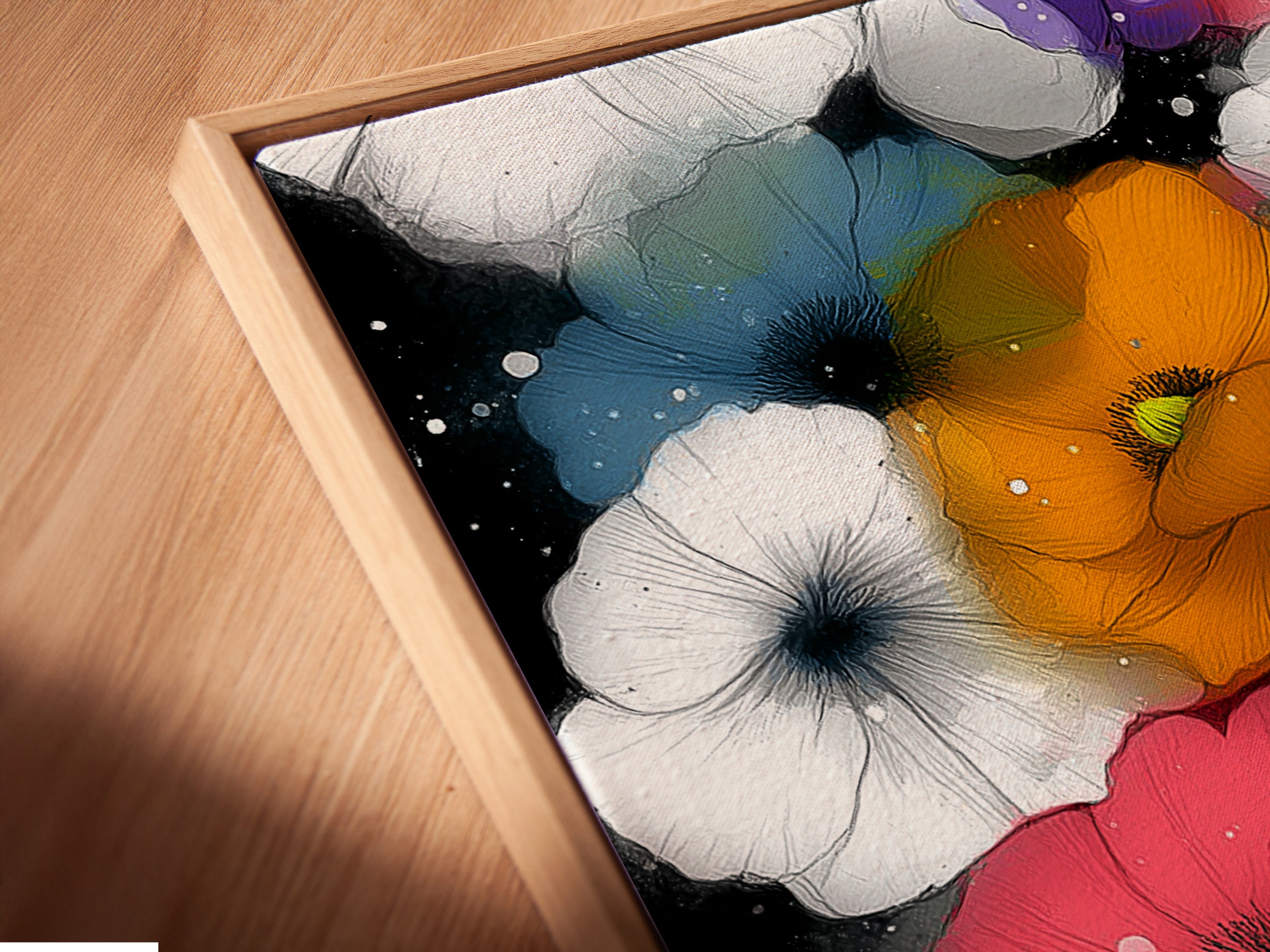 A close-up shot of a canvas print in a floating frame is displayed. The floating frame gives the artwork a modern and elegant look. The vibrant colors of the floral artwork stand out. This piece is ideal for adding contemporary art to your living space. Discover floral canvas prints.