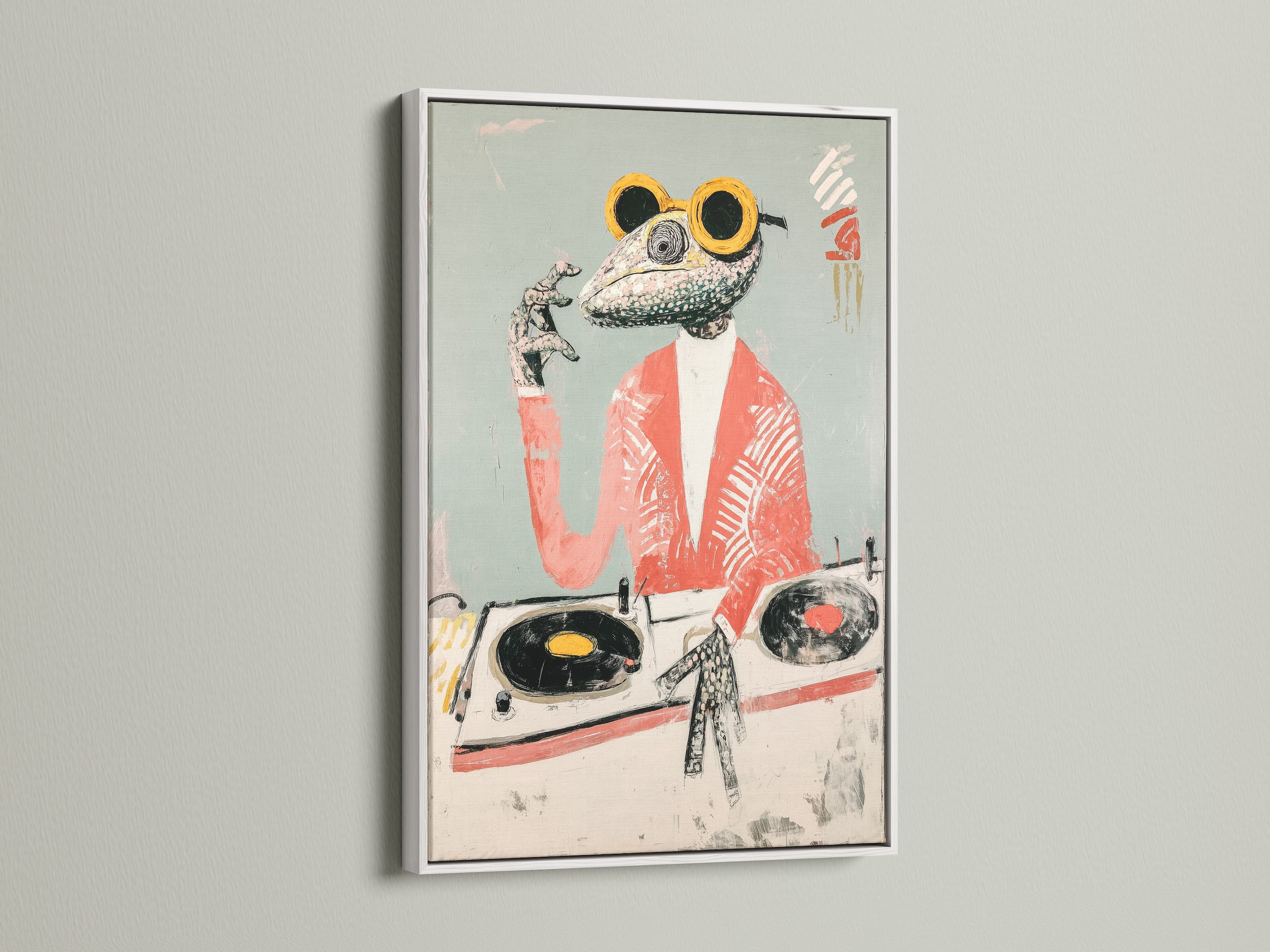 A framed Frog DJ art print is displayed in a white frame. The white frame provides a clean contemporary look for the retro animal art. It is perfect for showcasing funny frog art and quirky wall art. The neutral color enhances office wall decor.
