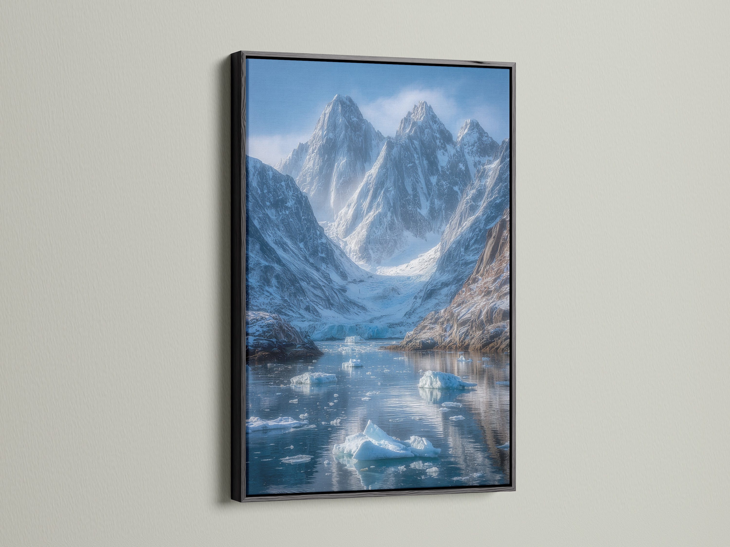 The mountain glacier artwork is presented in a sleek black frame.  The arctic print highlights the beauty of the winter landscape. It adds a contemporary touch as office wall decor or living room art.