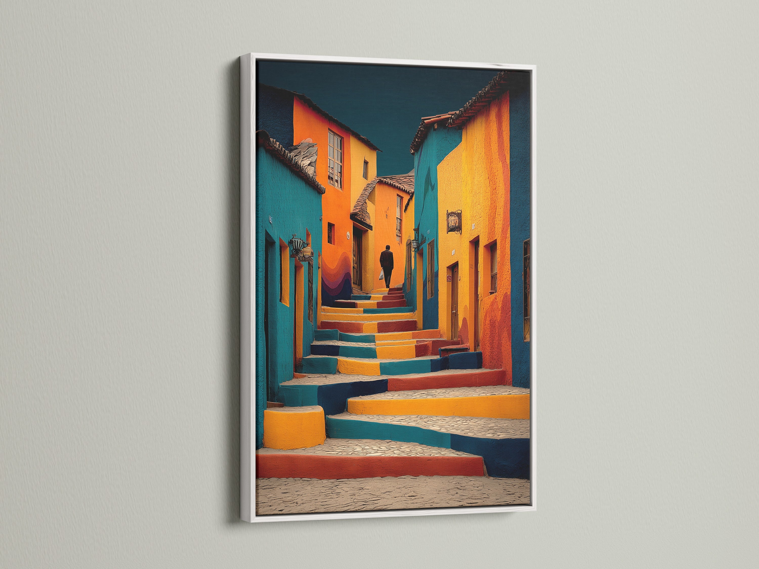 Artwork featuring a vibrant street scene is displayed in a white frame. The white frame provides a clean and modern aesthetic. The artwork captures a colorful scene of buildings and steps. This framed piece will brighten any room.