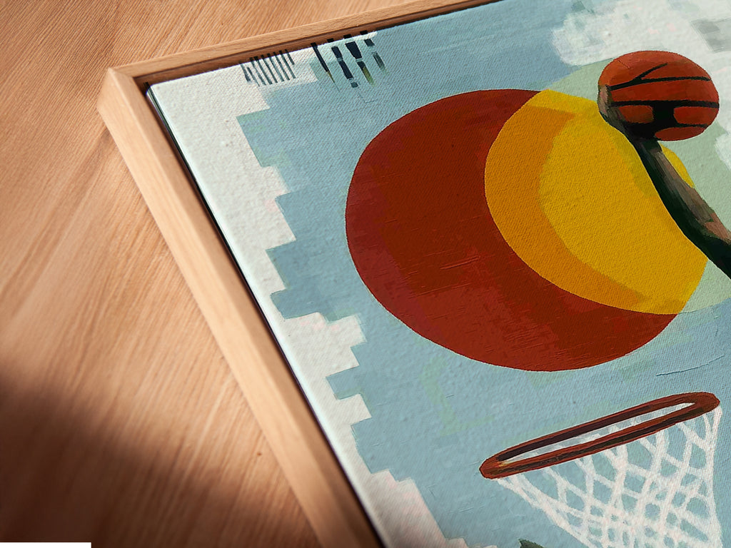 Close up of a canvas print in a floating frame. The artwork features a basketball astronaut. This retro space art adds a modern touch. Perfect for game rooms dorm rooms and unique wall art displays.