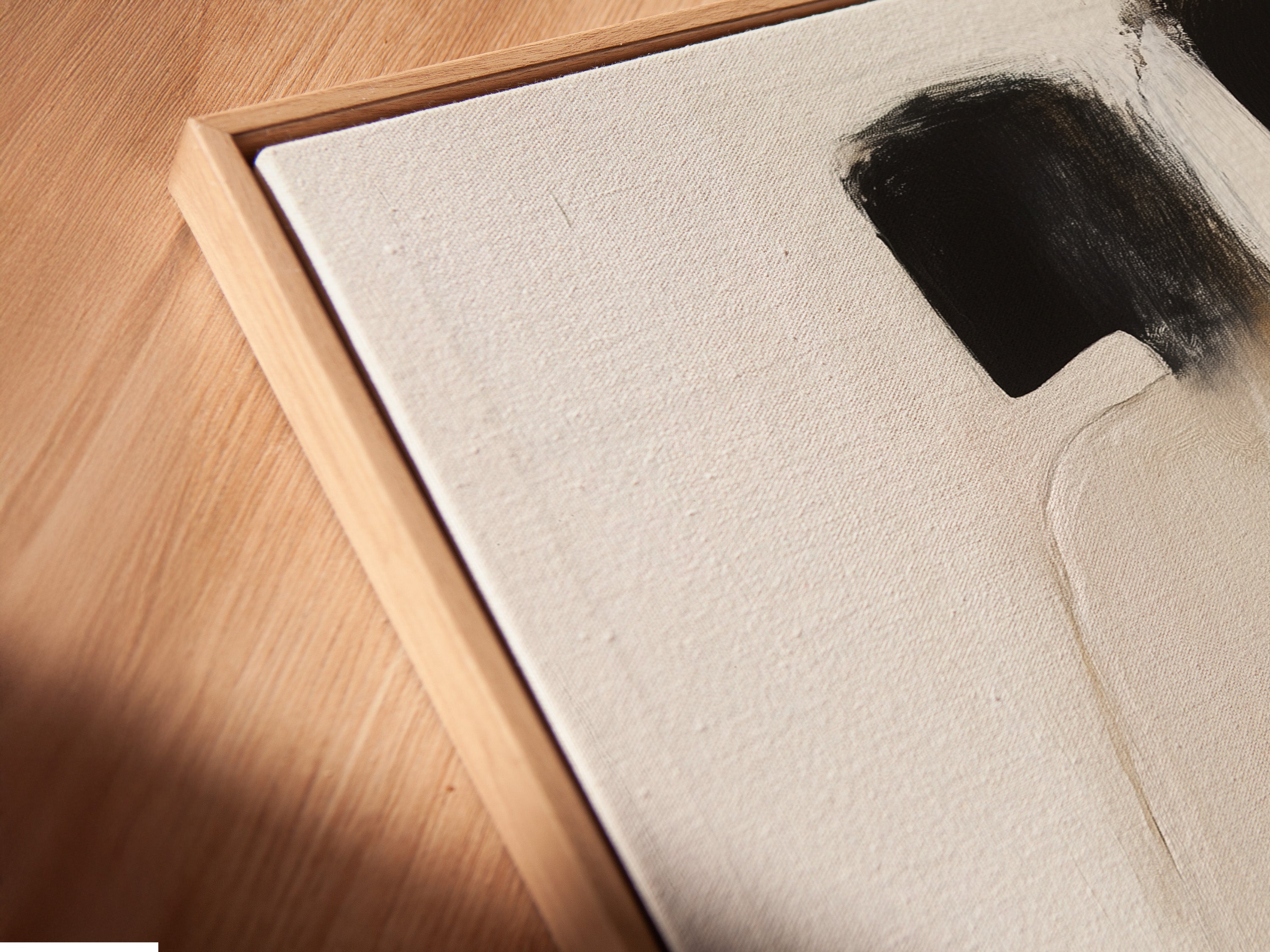 Close-up of a canvas print in a floating frame. The abstract couple art showcases minimalist figures. This modern romance artwork adds depth and elegance. Perfect for contemporary home decor and bedroom wall art.