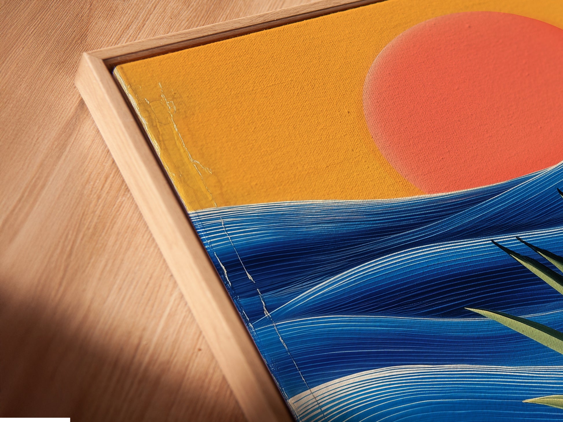 Close-up of a canvas print in a floating frame. The coastal sunset artwork features abstract ocean waves. Enhance your living space with this modern art. Perfect for any room.