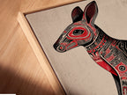 Close-up angled view of a canvas print in a floating frame. The Aboriginal Kangaroo artwork is stretched perfectly. The floating frame gives a modern gallery look. The red and black tribal patterns are clearly visible. It's a stunning piece of animal canvas art.