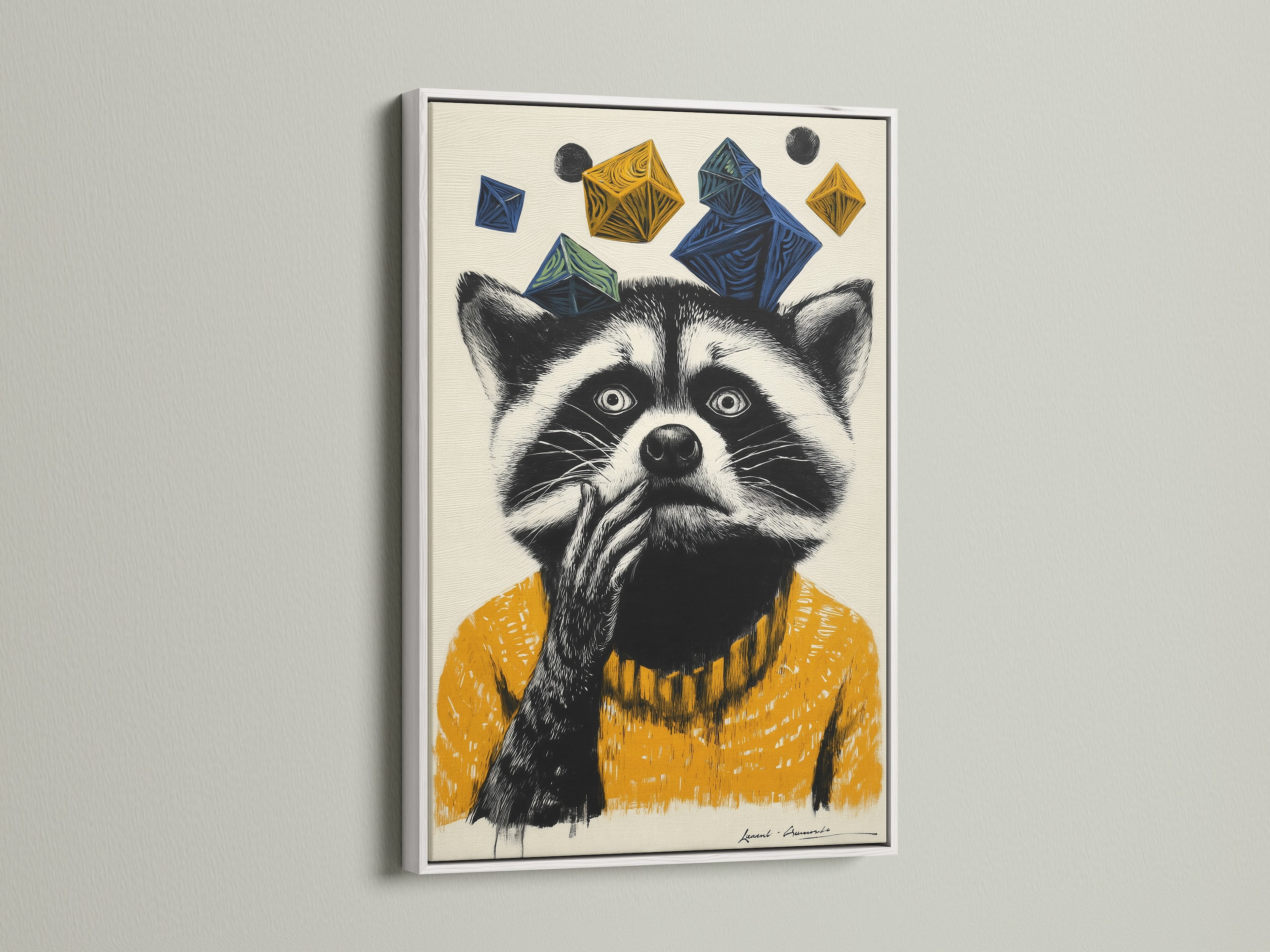 A delightful raccoon artwork is presented in a white frame. The whimsical animal art features a raccoon wearing a mustard yellow sweater. Geometric shapes in blue and yellow add a contemporary touch. This kids room decor is ideal for a nursery or playful space. The animal portrait art adds character to any wall.