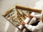 Woman rolling a fine art poster paper. The woman is carefully handling the fine art poster paper. The fine art poster paper is a high quality print option. Fine art poster paper allows for crisp colors. We ensure the best print quality for your artwork. Your artwork will look stunning.