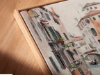 Close up angled view of a canvas print in a floating frame. The Venice Canal artwork provides a modern touch. The Italian watercolor print enhances the beauty of this European cityscape.