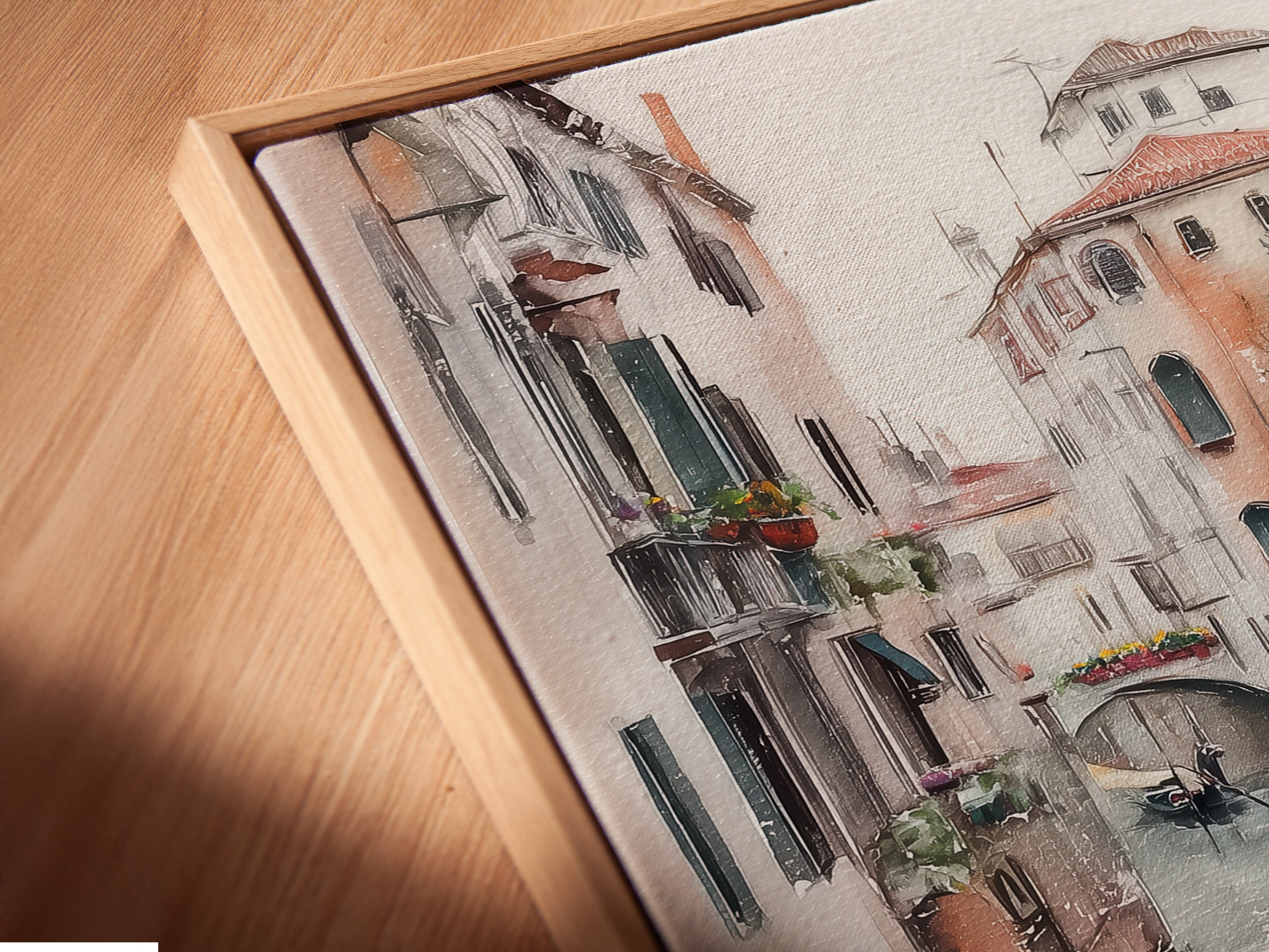 Close up angled view of a canvas print in a floating frame. The Venice Canal artwork provides a modern touch. The Italian watercolor print enhances the beauty of this European cityscape.