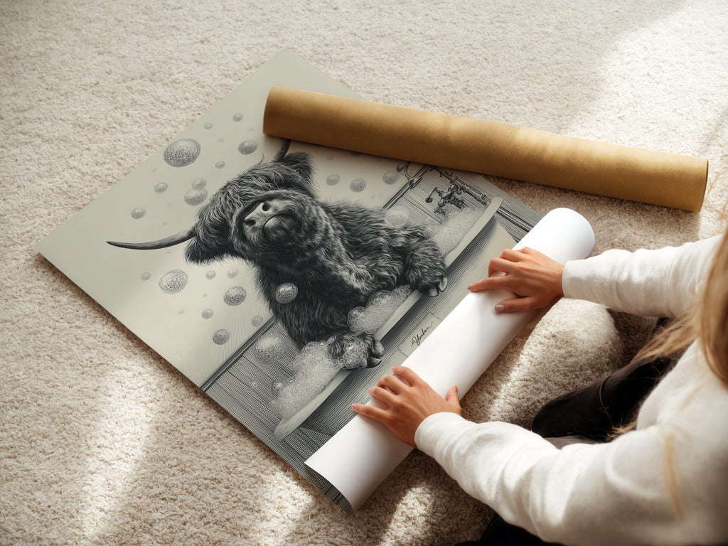 A woman is carefully rolling a fine art poster paper. The paper will feature the highland cow art. This farmhouse animal poster is perfect. It's great for creating funny bathroom wall art. This unique wall art is ideal for animal lovers.