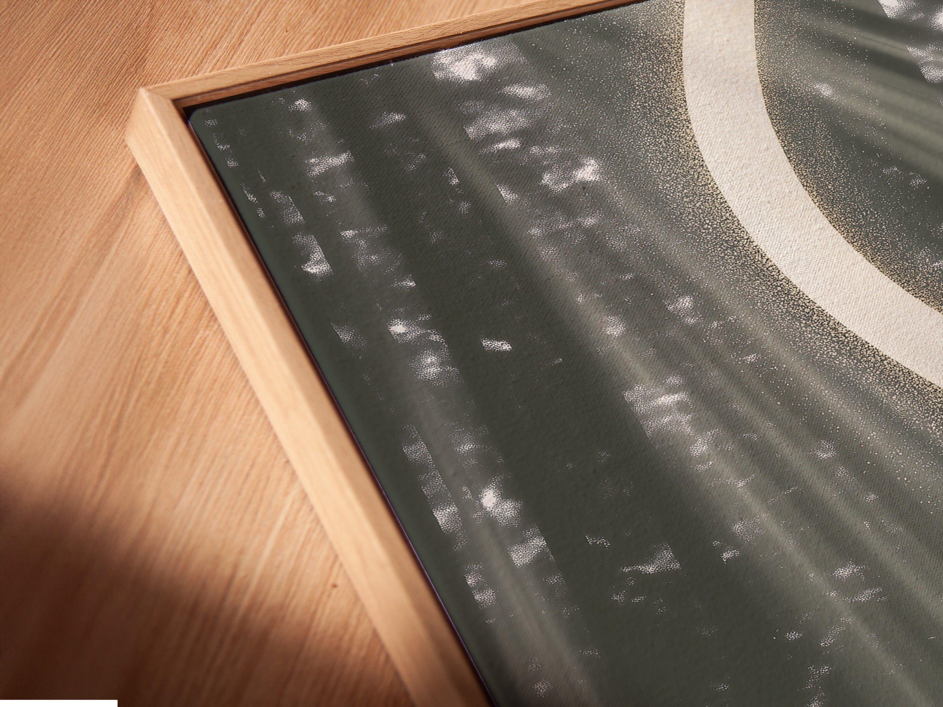 Experience the beauty of abstract river art up close. This modern canvas print is displayed in a floating frame. The sage green and gold accents create a stunning visual. Enhance your wall decor with this contemporary artwork. Ideal for living rooms offices and more