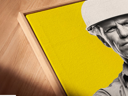Close up of a canvas print in a floating frame. The Construction Worker artwork is an architect print. It is a perfect gift for engineers. This modern canvas art is yellow wall art. It is great for office wall decor. This worker artwork is building art.