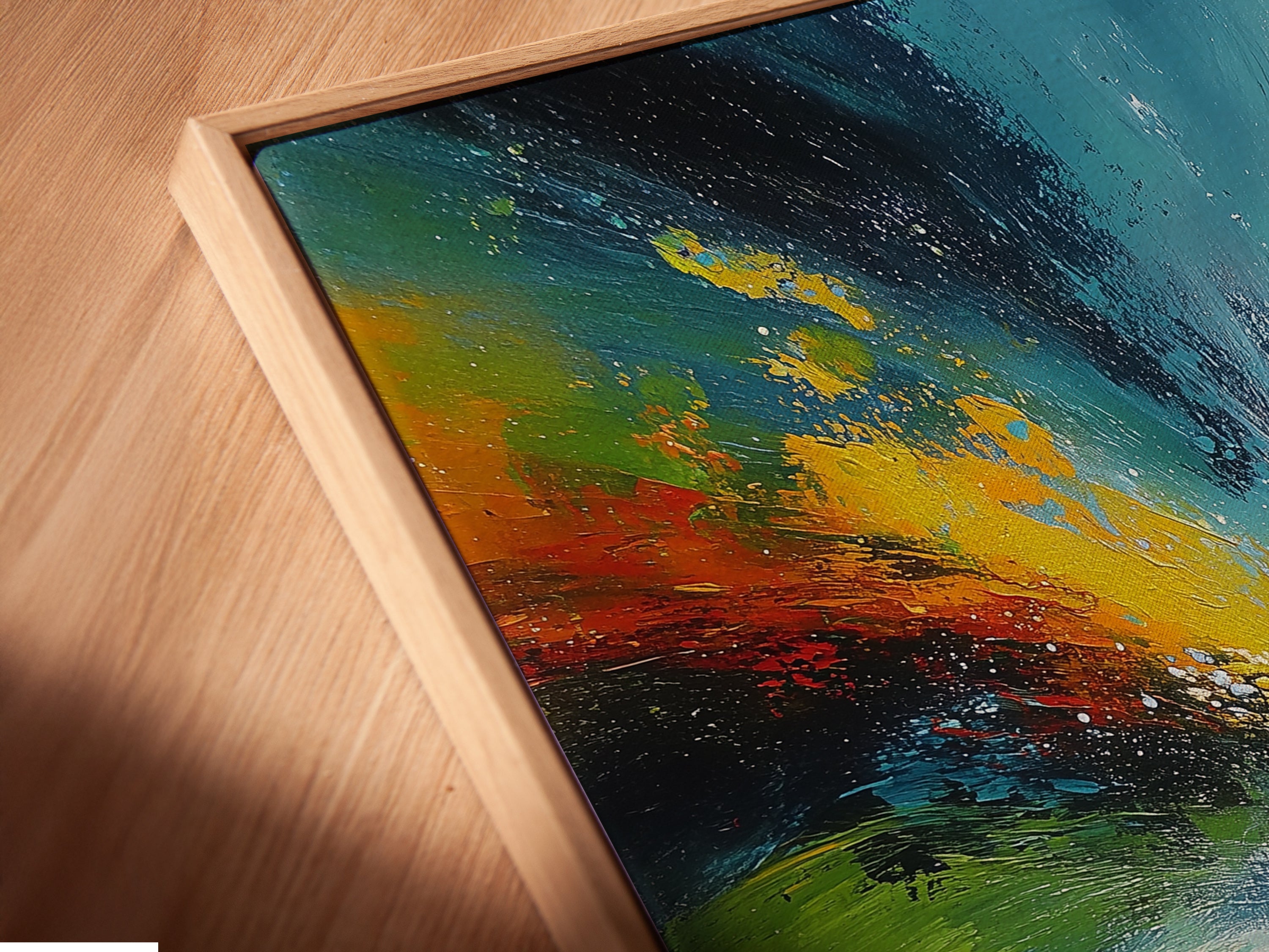 A close up shot reveals the exquisite detail of a canvas print in a floating frame. The abstract swirl artwork features turquoise green and yellow hues. This contemporary piece adds depth and dimension to any room. Perfect for modern minimalist and eclectic interiors.