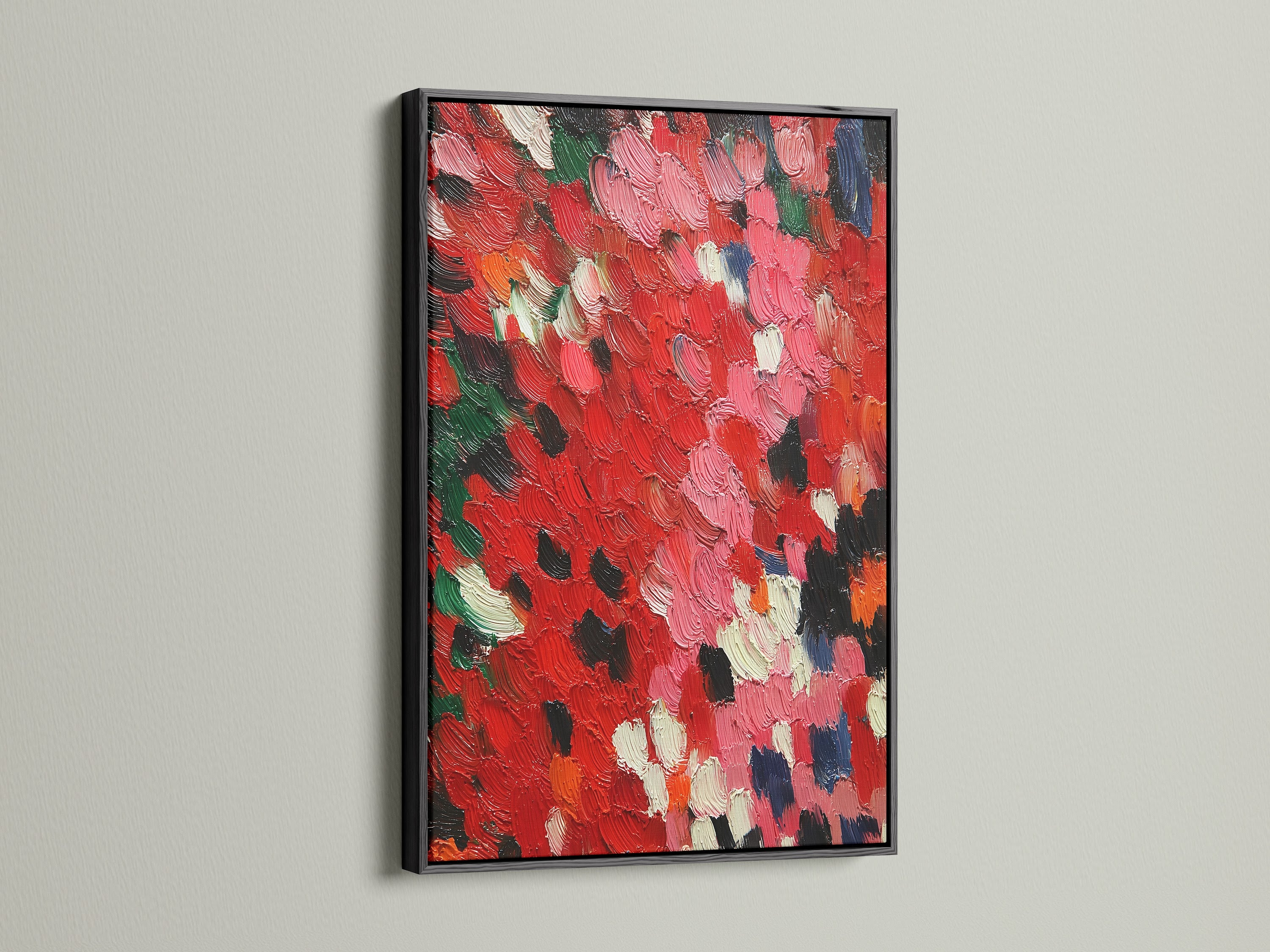 An abstract red artwork is elegantly presented in a black frame. The textured canvas showcases an impasto painting. The palette knife art adds a contemporary touch. This red wall art is a modern abstract piece. It enhances any space with a bold and sophisticated look. Perfect for modern home art.