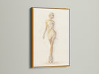Ballet Dancer Art Print with a gold frame on a white wall. This ballet artwork is a sophisticated addition to your decor. The figure drawing creates a chic ambiance. It's perfect for enhancing studio wall decor or adding a touch of elegance to office art.