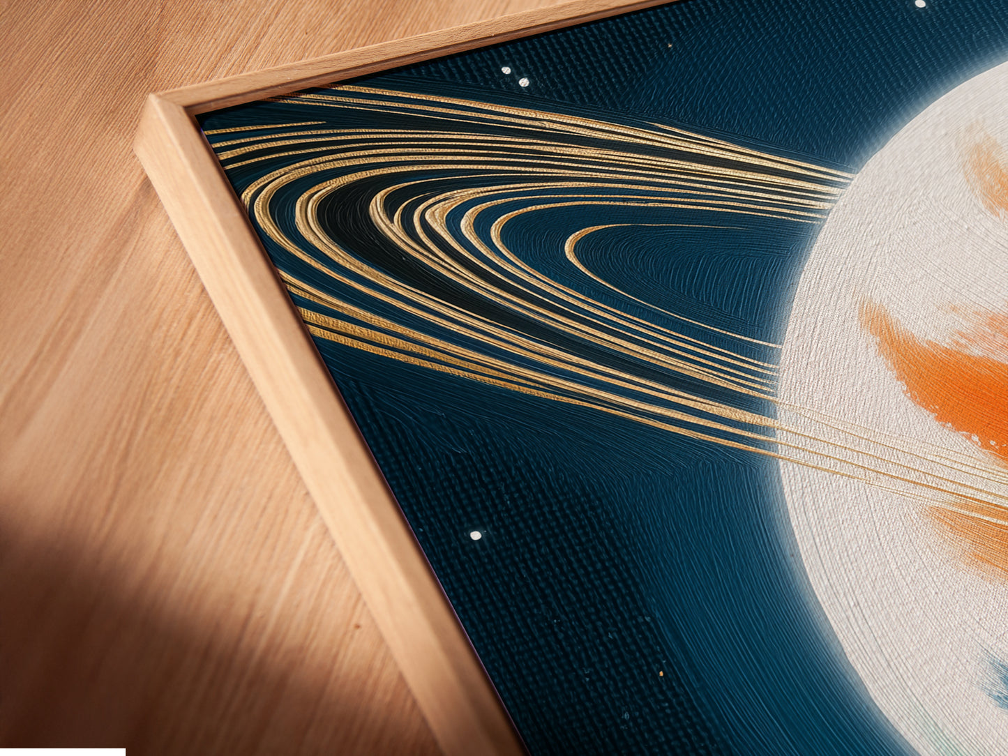 Close-up of a Saturn canvas print in a floating frame. The space canvas appears to float adding depth to the galaxy wall art. This celestial decor accentuates modern spaces. The abstract print becomes a focal point. Ideal as bedroom art. A modern colorful art piece.