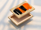 This stretched canvas print features Abstract Brush Stroke Art. The orange and black artwork is ready to hang. The stretched canvas provides a clean and modern look. Perfect for contemporary wall decor in living rooms or offices.
