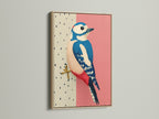 A close-up of a framed Woodpecker bird art print. The artwork is showcased in a beautiful oak frame. The pink and blue illustration adds a touch of modern elegance to any space. Ideal for Scandinavian or minimalist decor.