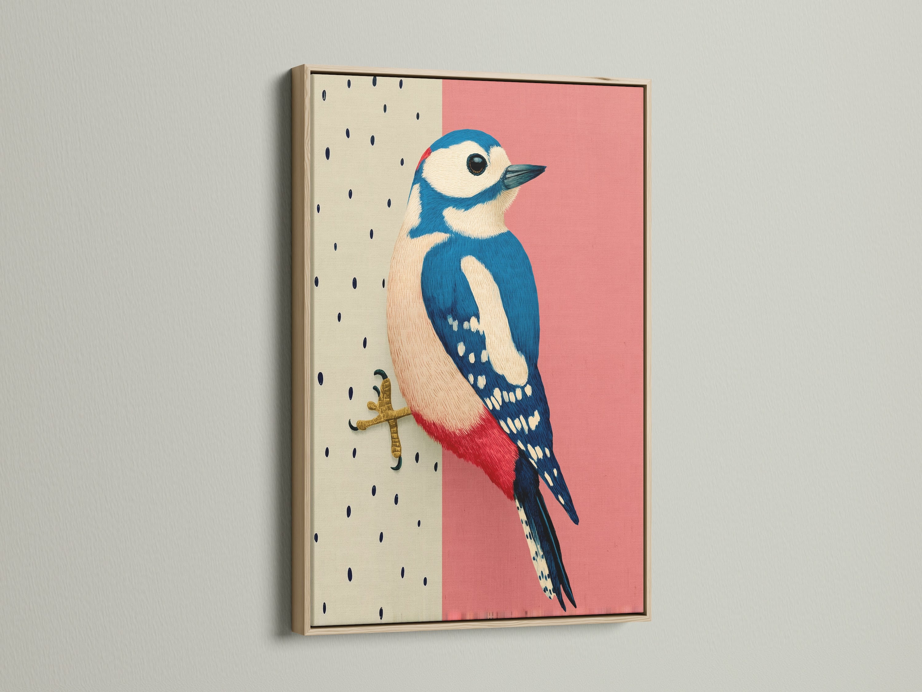 A close-up of a framed Woodpecker bird art print. The artwork is showcased in a beautiful oak frame. The pink and blue illustration adds a touch of modern elegance to any space. Ideal for Scandinavian or minimalist decor.