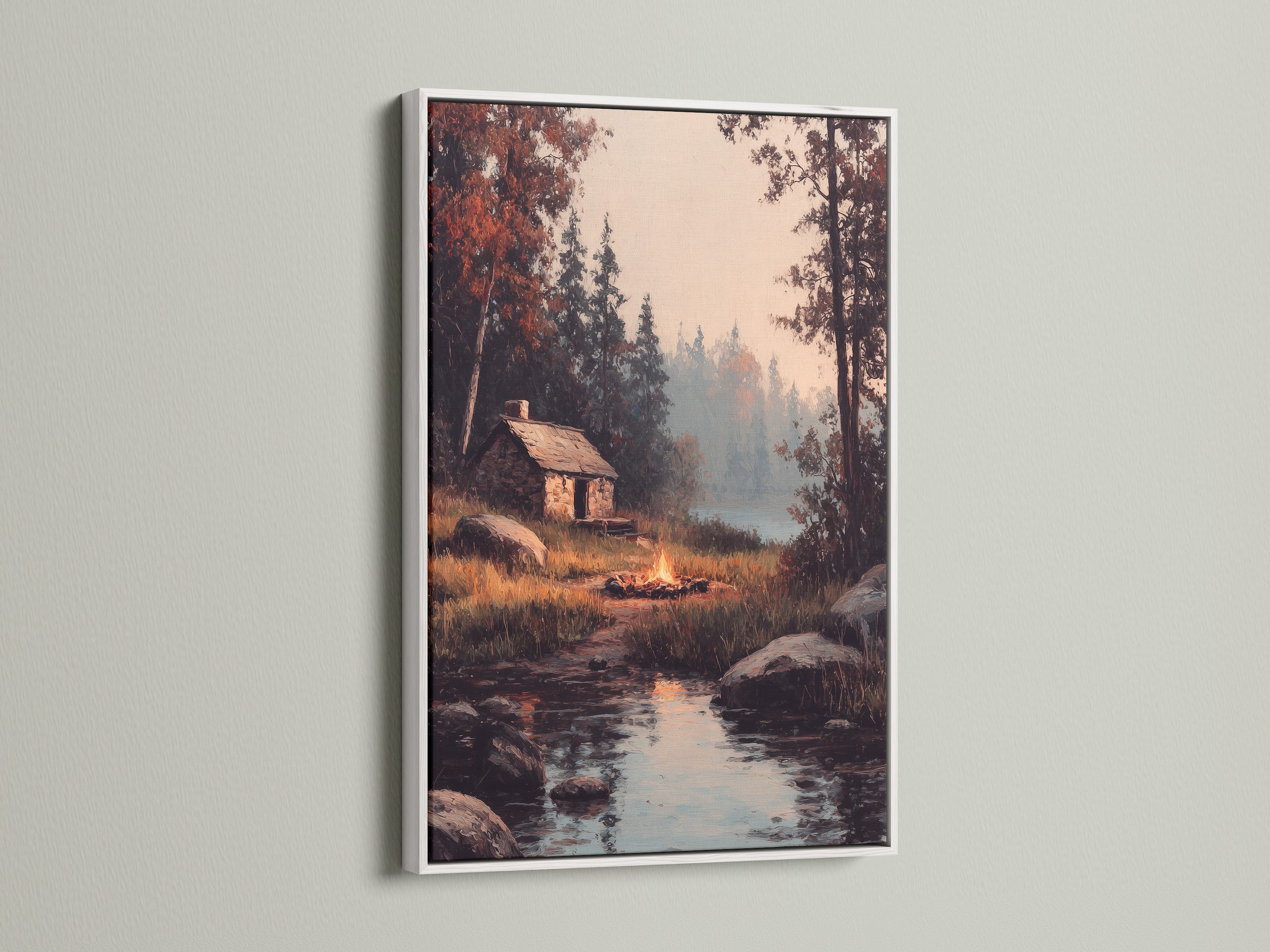 Artwork of a cozy cabin by a lake is elegantly framed in white. A white frame adds a touch of sophistication to your art. Explore the beauty of white frames. It is ideal for any interior decor.