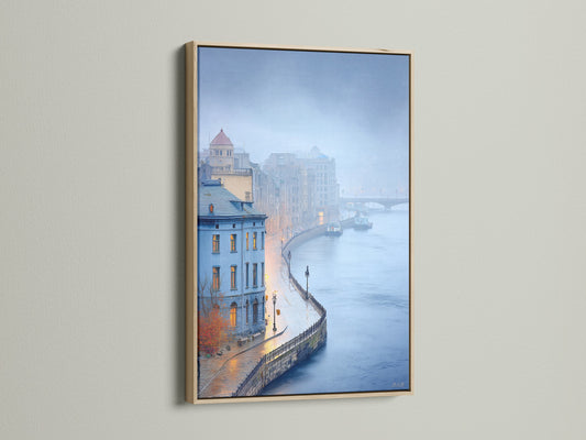 Cityscape art displayed in an oak frame. The artwork features a European city scene with moody blue tones. The oak frame enhances the contemporary style. Ideal for adding a touch of urban sophistication to any room.