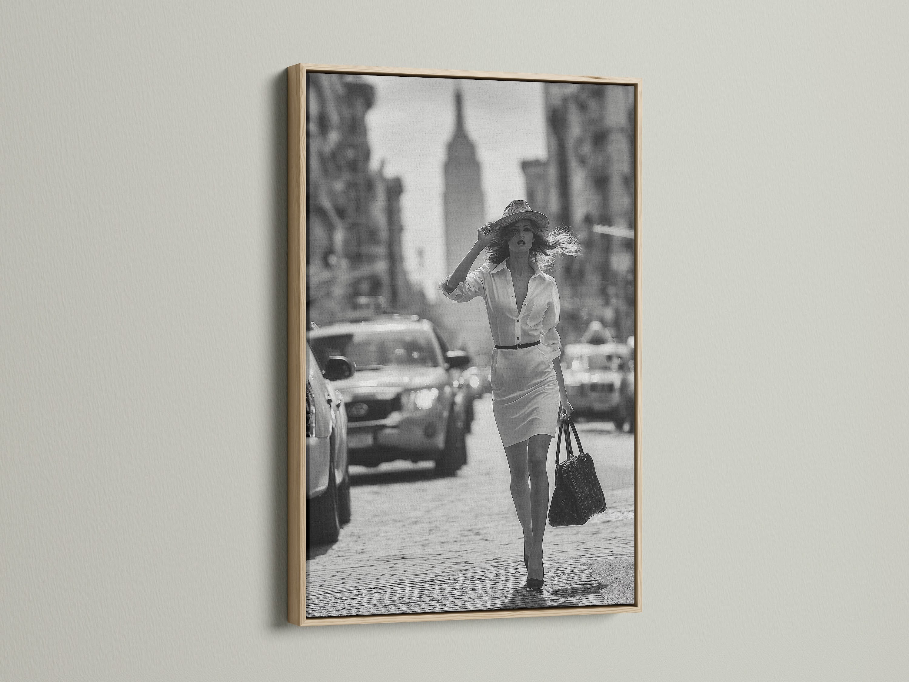 Enhance your artwork with our oak frame. This frame highlights a black and white photograph of a woman walking in a city. Our oak frames add warmth and sophistication to any room. Find the ideal frame for your cherished art.