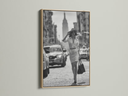 Enhance your artwork with our oak frame. This frame highlights a black and white photograph of a woman walking in a city. Our oak frames add warmth and sophistication to any room. Find the ideal frame for your cherished art.