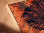 Close-up of a canvas print in a floating frame. This botanical fan palm artwork is modern. The burnt orange wall art enhances your space. Ideal for adding a touch of nature. This tropical foliage poster is a stunning addition.