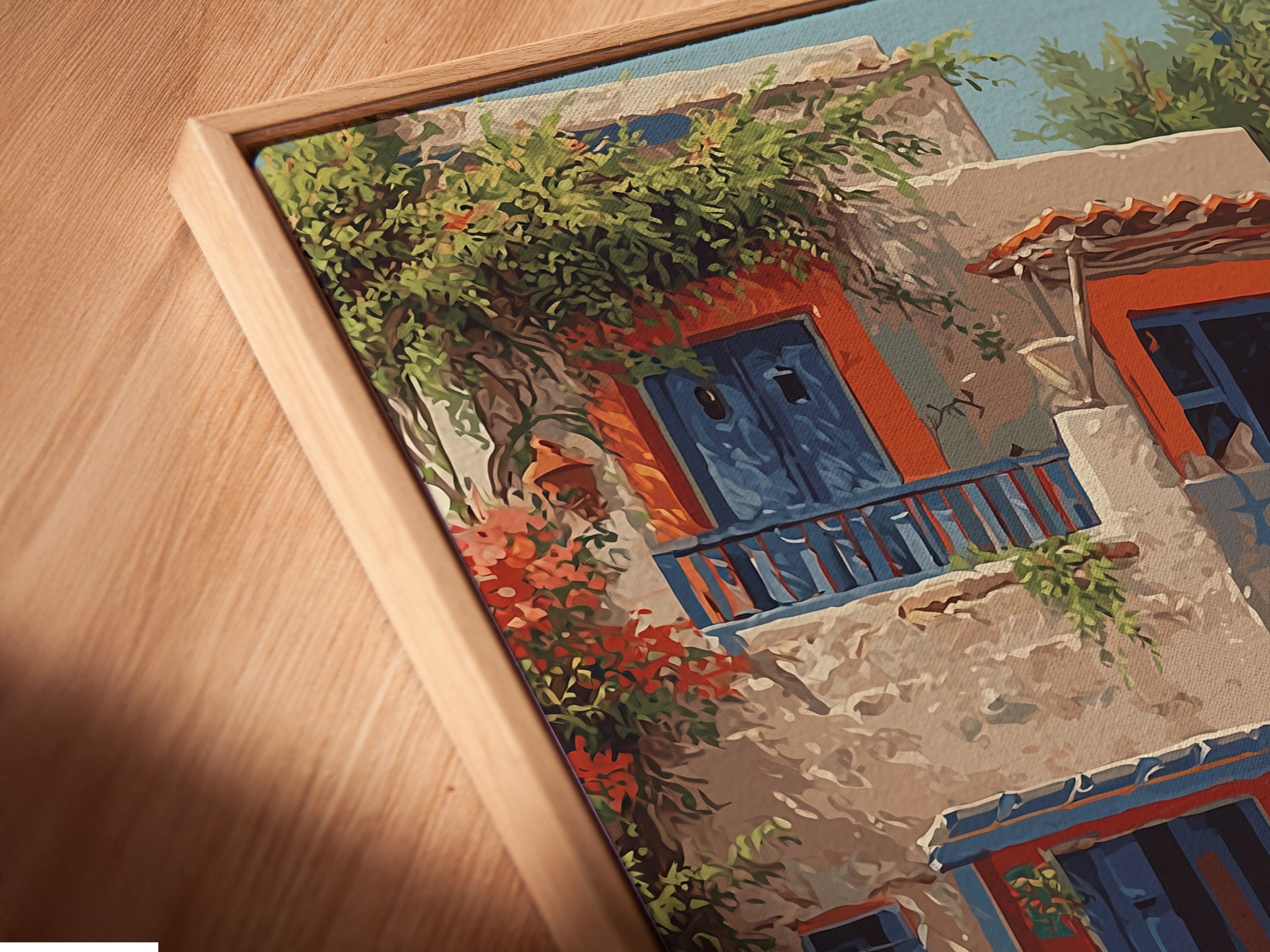 Close-up angled view of a canvas print in a floating frame. This bohemian wall art features teal blue and orange artwork. This travel art print is perfect for home wall decor. The figures print adds a colorful touch to any room. It is ideal for interior decorators seeking elevated Mediterranean decor. The floating frame enhances the artwork.