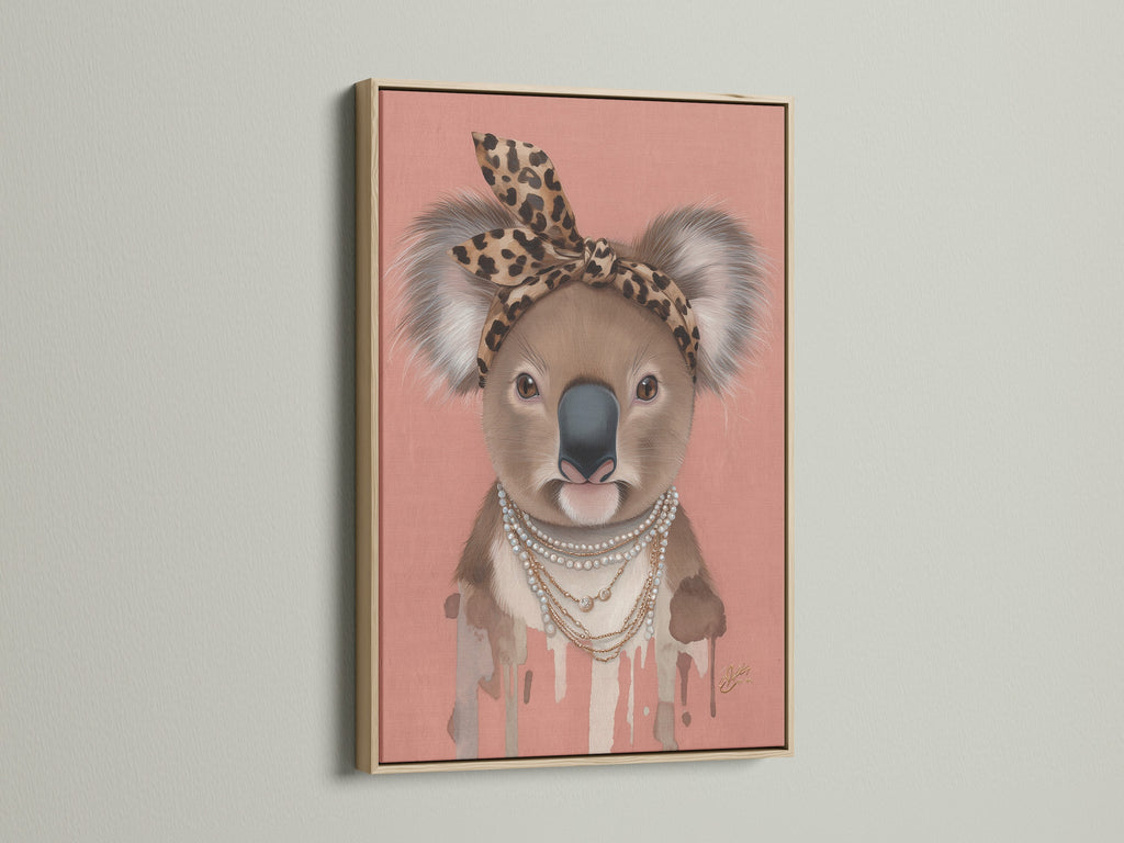Oak Frame presents the Koala Wall Art. This animal canvas print is perfect for a trendy nursery. The Koala wears a leopard print headband and pearl necklace. This Australian animal art is ideal for kids' rooms.